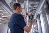 A man is inspecting pipes with a digital inspection camera. Anteprima dell’immagine prodotto