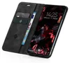 A black flip-style phone case with card slots and a euro banknote, shown open with a smartphone inside displaying the lock screen. Produktbild-Vorschau