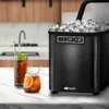 An ice maker on a kitchen counter next to two drinks. Podgląd zdjęcia produktu