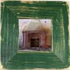 A framed picture of an old, brick fireplace inside a derelict building. Voir les images du produit