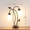 Lindby Tischleuchte Stefania, schwarz/gold, Glas, E14, 40 Produktbild-Vorschau 3