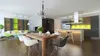 A modern dining room and kitchen area with a chandelier, dining table, chairs, and kitchen island. Produktbild-Vorschau