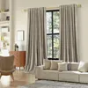 A living room scene with curtains, a sofa, and a chair. Náhled obrázku produktu