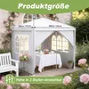 A white gazebo set up in a garden with a table and chairs inside, surrounded by flowers and greenery. Voir les images du produit
