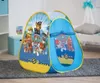 A Paw Patrol pop-up tent is set up on a gray rug in a child's room, with a bed and toy chest in the background. Produktbild-Vorschau
