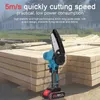 A cordless chainsaw is shown in front of stacks of lumber. Podgląd zdjęcia produktu