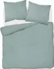 A neatly made bed with mint green striped bedding and two pillows. Náhled obrázku produktu