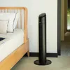 A black tower fan stands next to a wooden bed with white bedding in a room. Produktbild-Vorschau