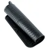 A black silicone drying mat with a wavy pattern is shown rolled up and placed on its base. Produktbild-Vorschau