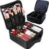 A black makeup organizer case is shown open, displaying various makeup products and brushes inside. Another similar, closed makeup case is visible in the background. Náhľad obrázku produktu
