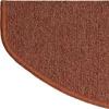 A close-up view of a brown, semi-circular carpet stair tread with a darker brown binding along the curved edge. Anteprima dell’immagine prodotto