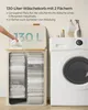 A laundry basket with two compartments next to a washing machine, with laundry detergent bottles on top of the washing machine. Produktbild-Vorschau
