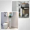 A collage of two bathroom scenes, one showing a toilet with a slim storage cabinet next to it, and the other showing a close-up of a bathroom vanity with storage. Produktbild-Vorschau