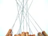 A close-up view of multiple metal skewers with wooden handles, fanned out against a white background. Produktbild-Vorschau