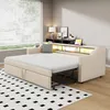 A beige sofa bed is extended into a bed, with a shelf above it containing decorative items and lighting. Voir les images du produit