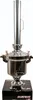 A stainless steel samovar with a chimney, sitting on a black base with text. Produktbild-Vorschau