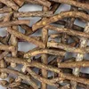 A close-up, overhead view of a woven arrangement of natural wood branches and twigs. Produktbild-Vorschau