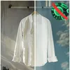 A white shirt is shown split down the middle, with one side appearing slightly dingy and the other side bright white. A graphic of bacteria with a red 'X' over it is in the upper right corner. Produktbild-Vorschau