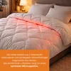 A close-up view of a white duvet on a bed, with a section illuminated by red light. Voir les images du produit