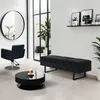 A modern waiting area or salon with a black bench, chair, and coffee table. Produktbild-Vorschau