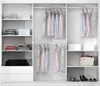 Interior view of a modern wardrobe with shelves and hanging clothes. Produktbild-Vorschau