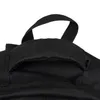 A close-up view of the top handle of a black backpack. Náhled obrázku produktu