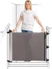 A woman is standing behind a baby gate installed at the top of a staircase. Náhľad obrázku produktu