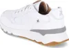 A white leather sneaker with gray and brown accents, shown from a rear-side angle. Produktbild-Vorschau