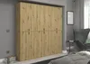 A bedroom scene with a large wardrobe, a chair, and a bed. Produktbild-Vorschau