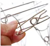 A hand is shown holding a metal clothespin. Produktbild-Vorschau