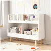 A white bookshelf with books and toys in a child's room. Náhľad obrázku produktu