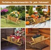 A collage of four images showing a wooden wheelbarrow used as a planter or decoration for different seasons: spring flowers, autumn pumpkins, Christmas gifts, and winter logs. Podgląd zdjęcia produktu