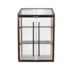 A greenhouse with wooden frame and clear polycarbonate panels. Voir les images du produit