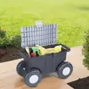 A garden wagon filled with gardening supplies sits on a patio with a lawn in the background. Produktbild-Vorschau