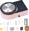 A pink pottery wheel machine with a set of pottery tools laid out below it on a white background. Produktbild-Vorschau