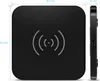 A top-down and side view of a black wireless charging pad with dimensions indicated. Produktbild-Vorschau