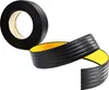 A roll of black anti-slip tape with yellow backing is shown, with a section unrolled. Anteprima dell’immagine prodotto