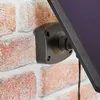 A close-up shot of a solar panel mount attached to a brick wall, with the solar panel itself visible. Produktbild-Vorschau