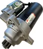 A close-up, angled view of a car starter motor against a white background. Anteprima dell’immagine prodotto