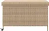 A front view of a beige poly rattan storage chest with wheels. Podgląd zdjęcia produktu