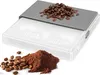 A digital kitchen scale with coffee beans and grounds. Produktbild-Vorschau