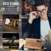 A man in a suit is adjusting his glasses while a phone case with a kickstand is displayed. Produktbild-Vorschau