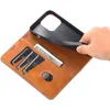 A hand is shown inserting a phone into a brown leather wallet-style phone case. The case has slots for cards and cash. Produktbild-Vorschau