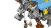 A close-up of a LEGO AT-TE walker with a minifigure standing next to it. Arrows indicate movement. Podgląd zdjęcia produktu