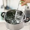 A hand holding a jar lifter over a pot of jars. Produktbild-Vorschau