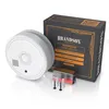 A product shot of a smoke detector, its packaging, and accessories against a white background. Produktbild-Vorschau