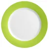 A top-down view of a white plate with a green rim. Produktbild-Vorschau