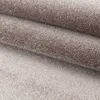 A close-up view of a folded carpet, showing its texture and fibers. Podgląd zdjęcia produktu