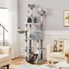A multi-level cat tree with several cats interacting with it, placed in a living room setting with furniture and decor. Podgląd zdjęcia produktu