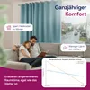 A couple relaxing on a couch in front of a window with curtains, with a graph showing temperature comparison. Produktbild-Vorschau